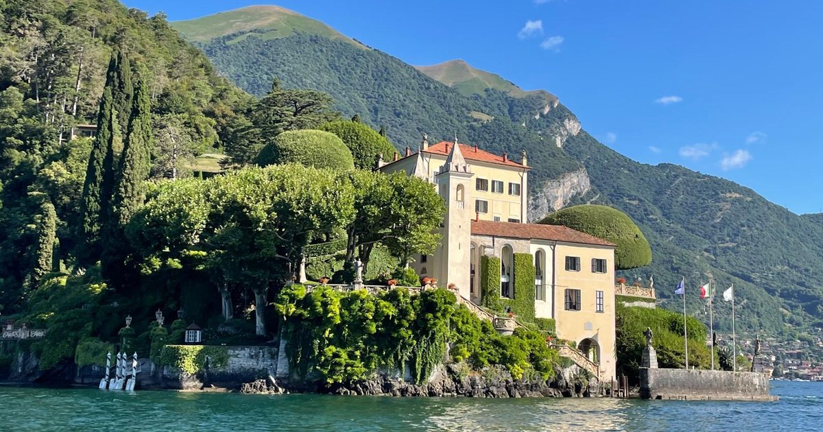 A lakeside villa among cypress trees on the shore of Lake Como